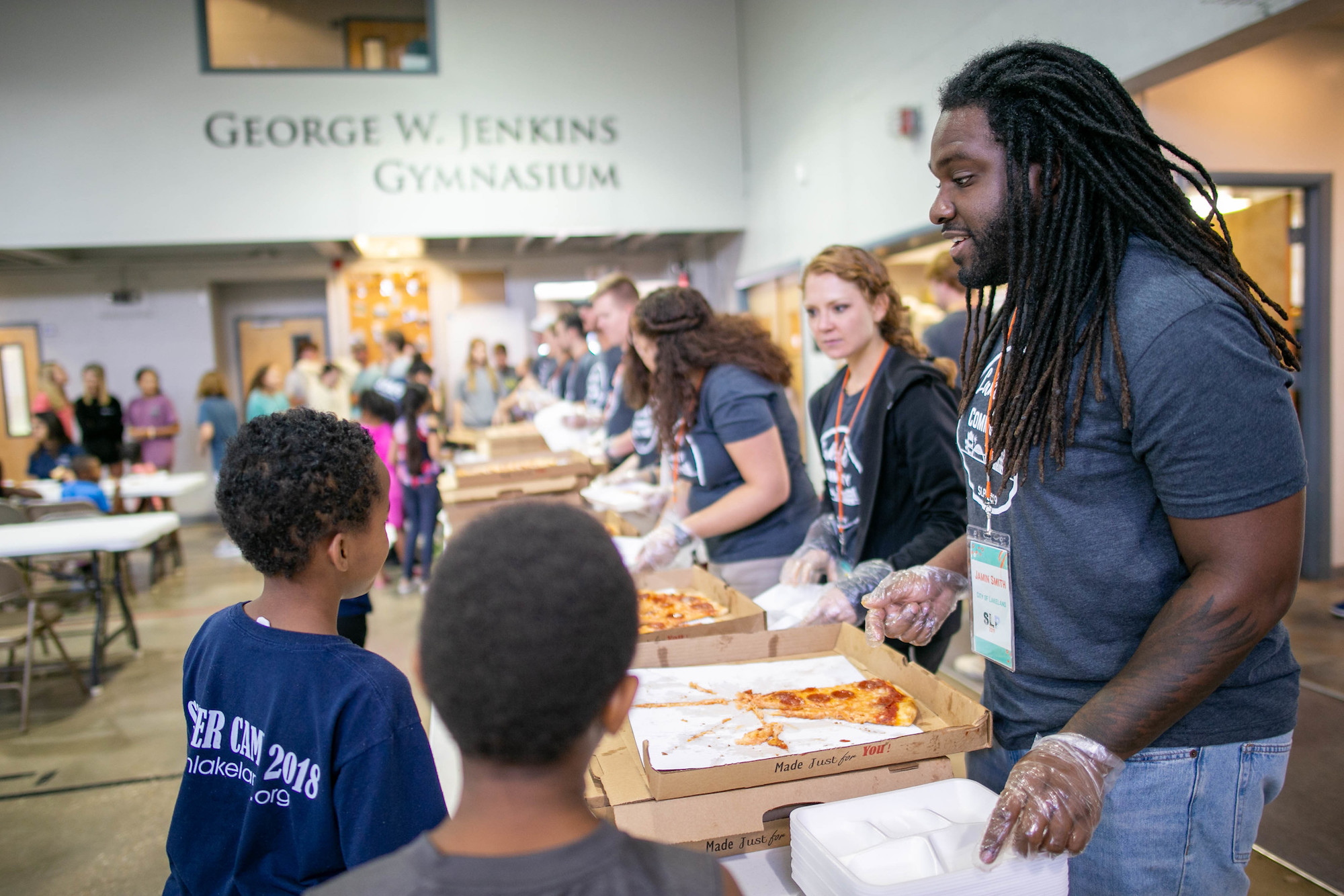 A young professional serves along side the LEDC Summer Leadership Program.